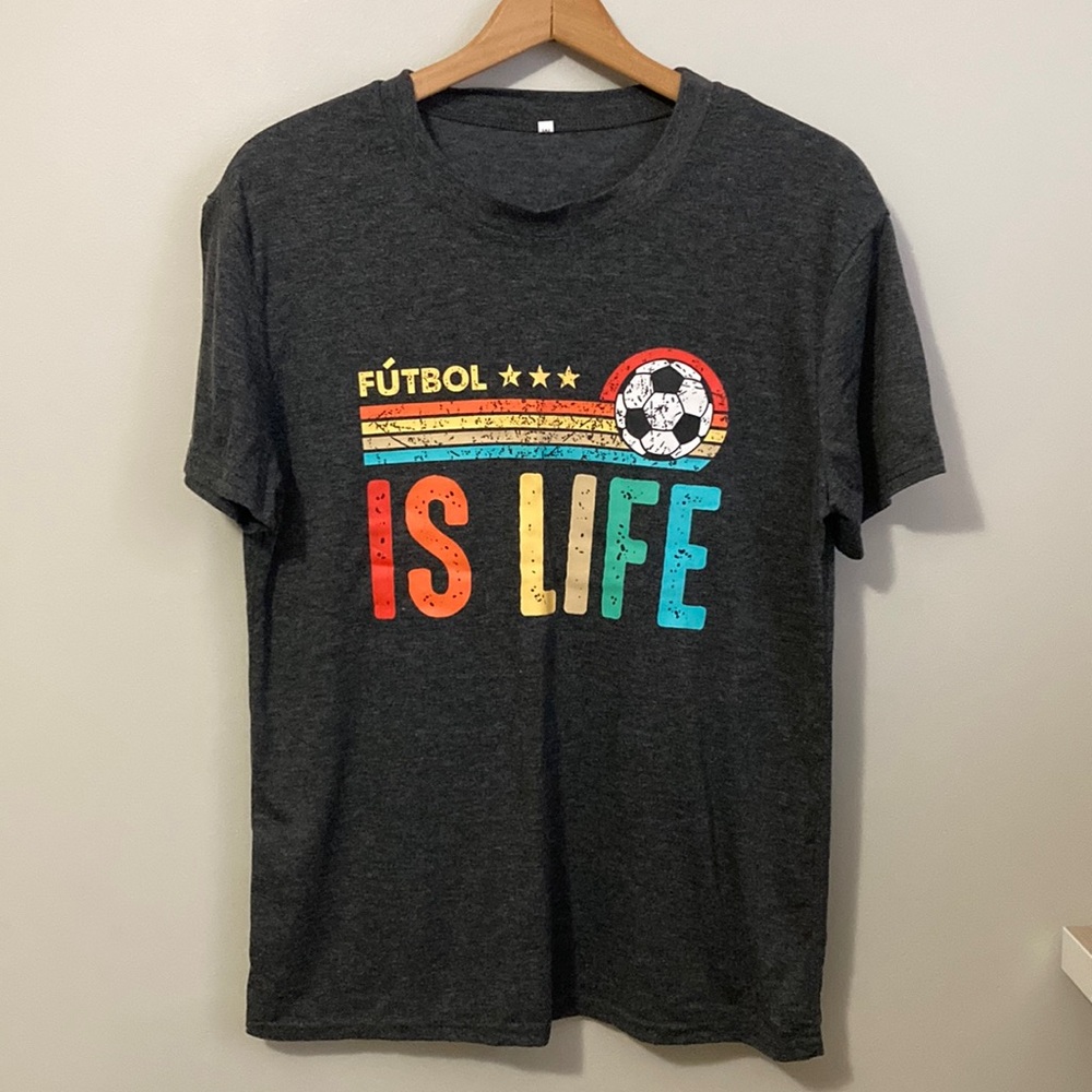 Unisex Soccer Futbol is life tee, size medium, gray with rainbow colors
